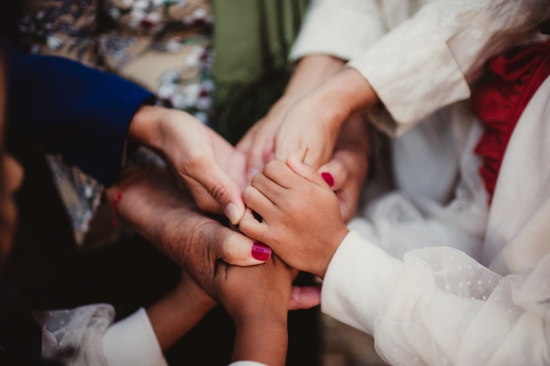family group holding hands