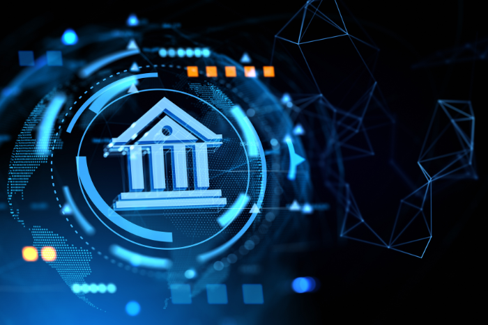 Digital bank icon surrounded by glowing blue technology elements on a dark background.