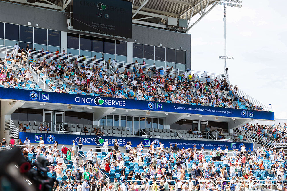 Image of the Lindner Family Tennis Center with people in the stands