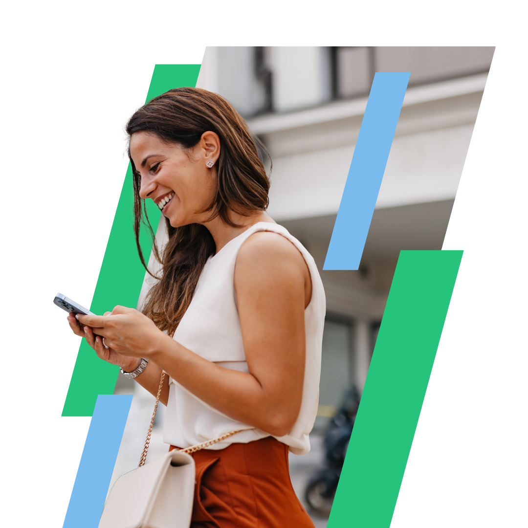 Woman looking at her phone smiling