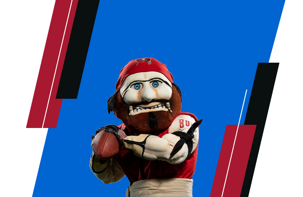 The bucs mascot throwing a football