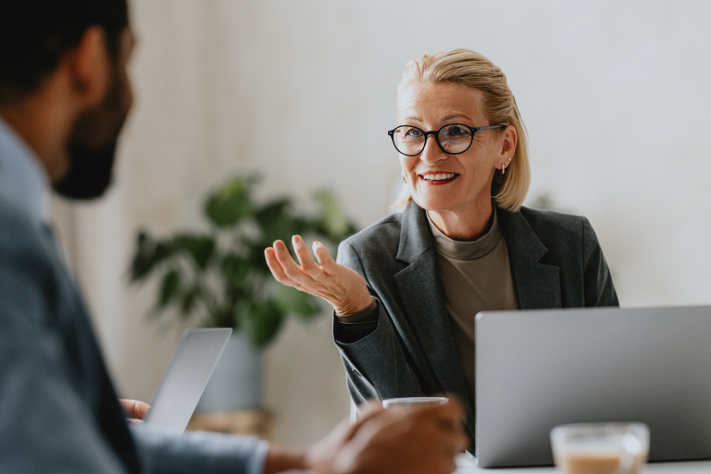 older women talking looking very professional having a meeting 
